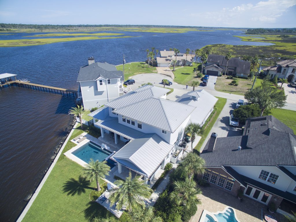Aerial view of waterfront homes with docks.