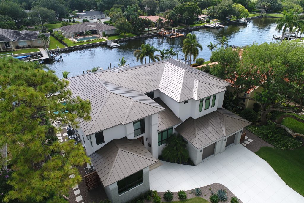 Modern riverside house with landscaped garden and dock.