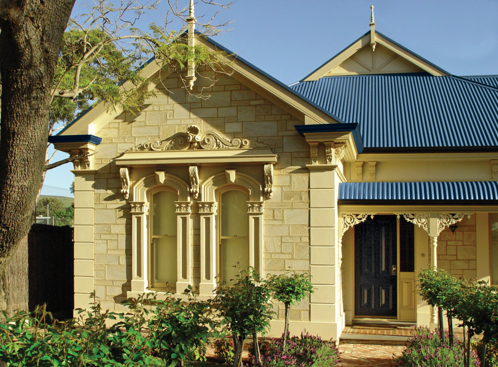 Victorian-style house with ornate stone facade.