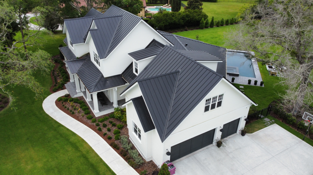 Aerial view of modern house with pool and garden