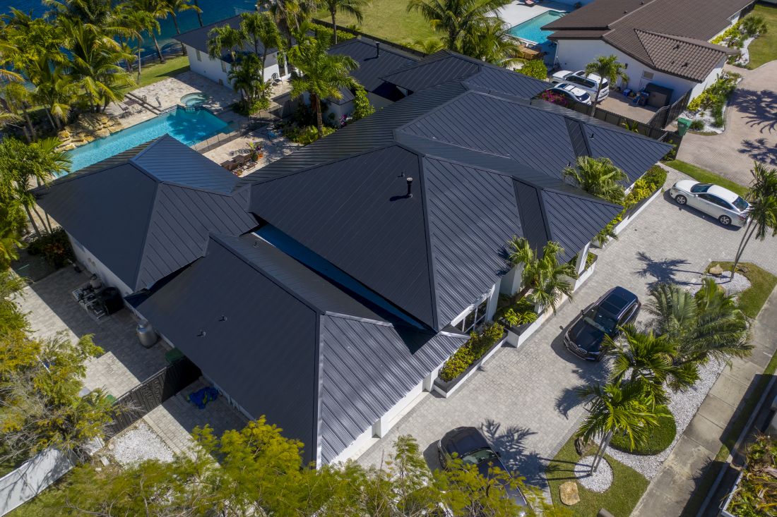 Aerial view of modern house with pool.