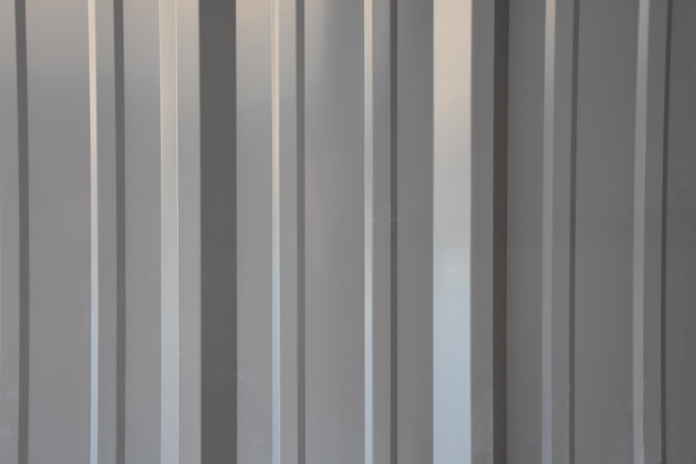 r-panel gray metal sheet with ridges used for wall panels
